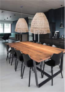 Pendant Lighting Modern WOVEN Craftmade P915ESP1 above a wooden dining room table with black chairs