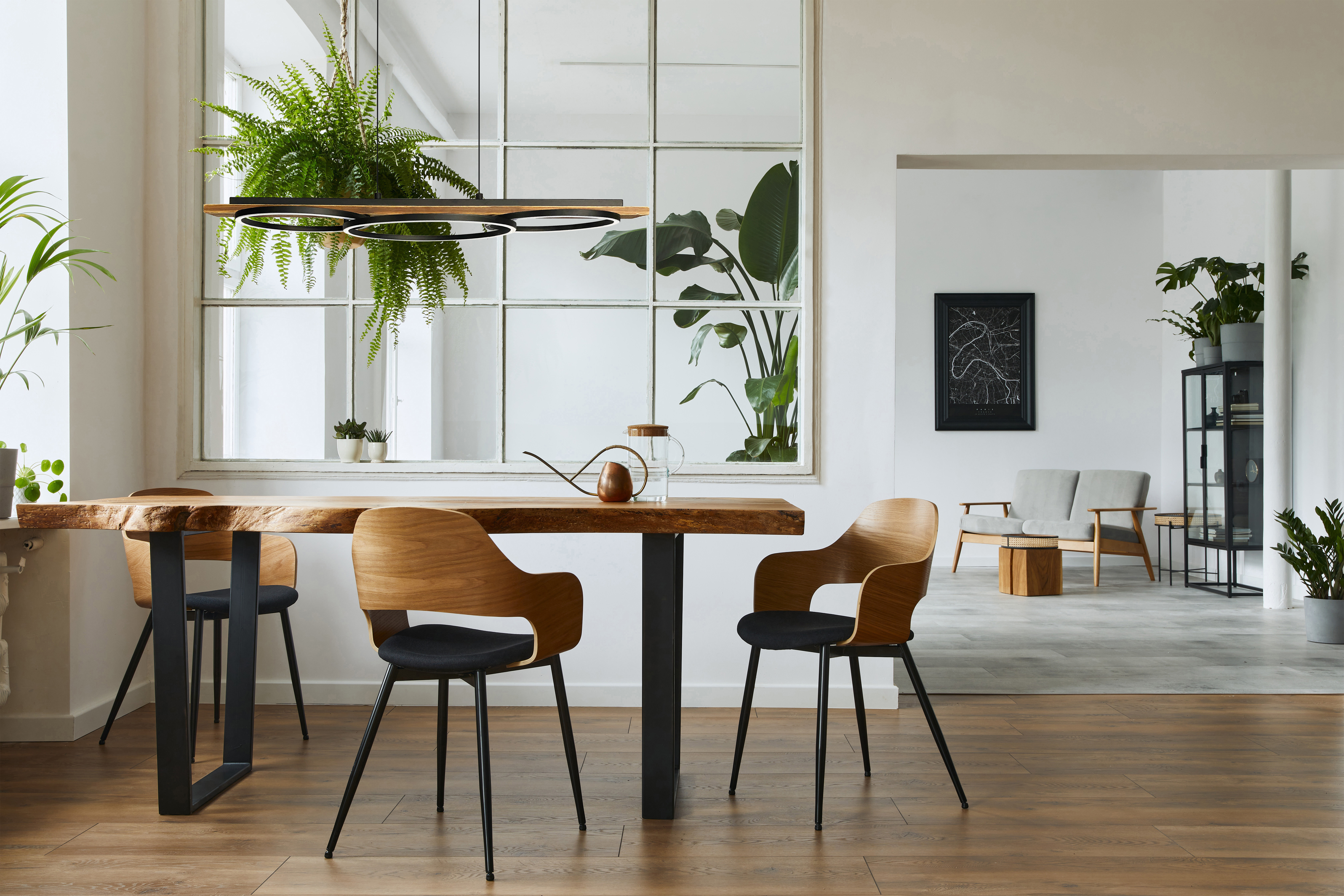 Modern pendant BOYAL Eglo 204922A above wooden dining table with wooden chairs