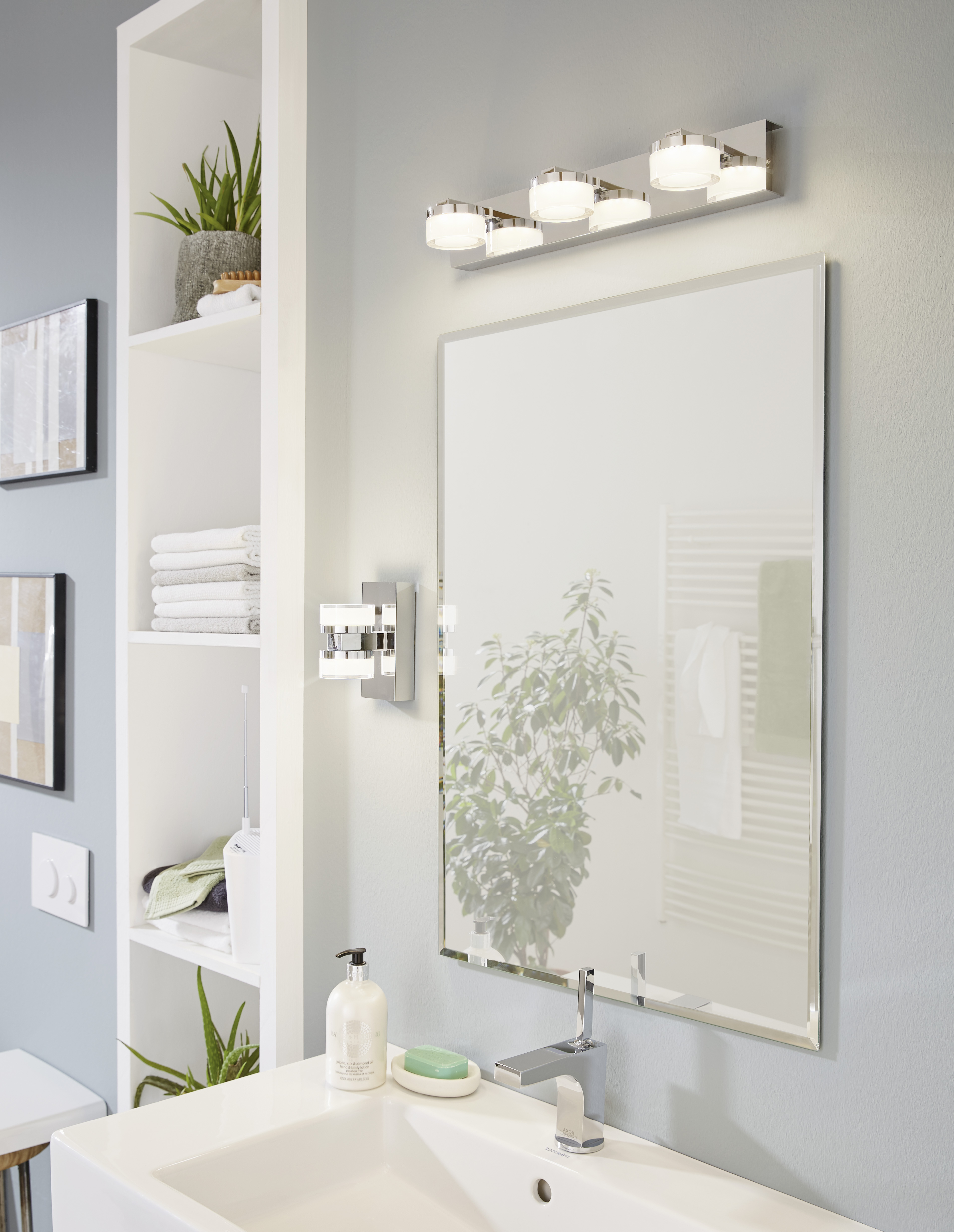 Modern wall sconce ROMENDO Eglo 94653A in the bathroom above the sink with mirror