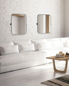 Miroir moderne CAIN Canarm RT31MBK2023 dans le salon avec divans blanc et mur de briques blanches.